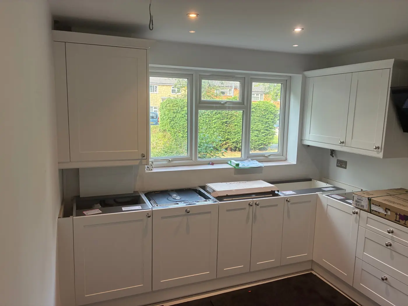 White shaker units fitted, worktops waiting to go on