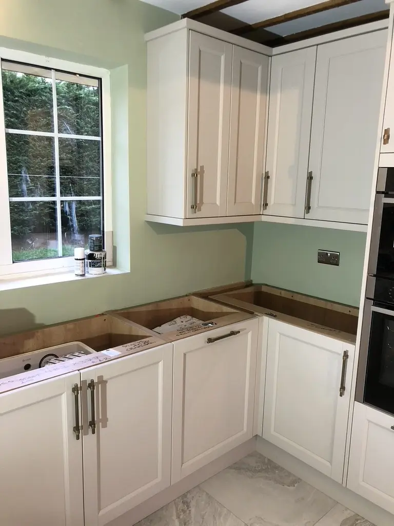 Cream shaker doors fitted, worktops not yet on